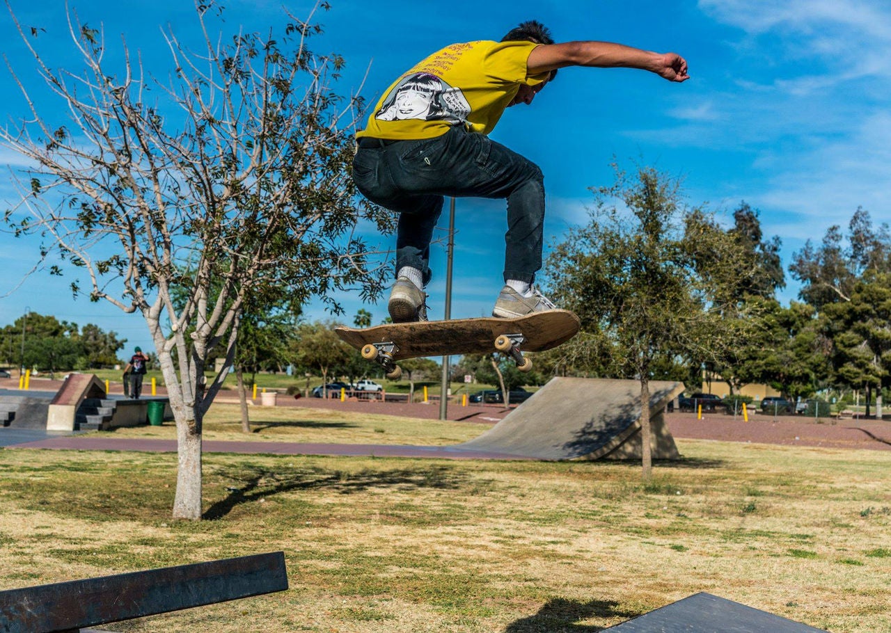 Photo of a person skateboarding at Cesar Chavez Skate Park